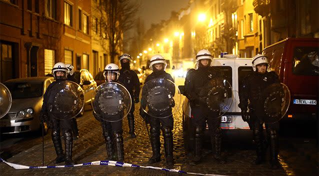 Police officers patrol after raids in which several people, including Paris attacks suspect Salah Abdeslam, were arrested on March 18, 2016. Photo: Getty Images