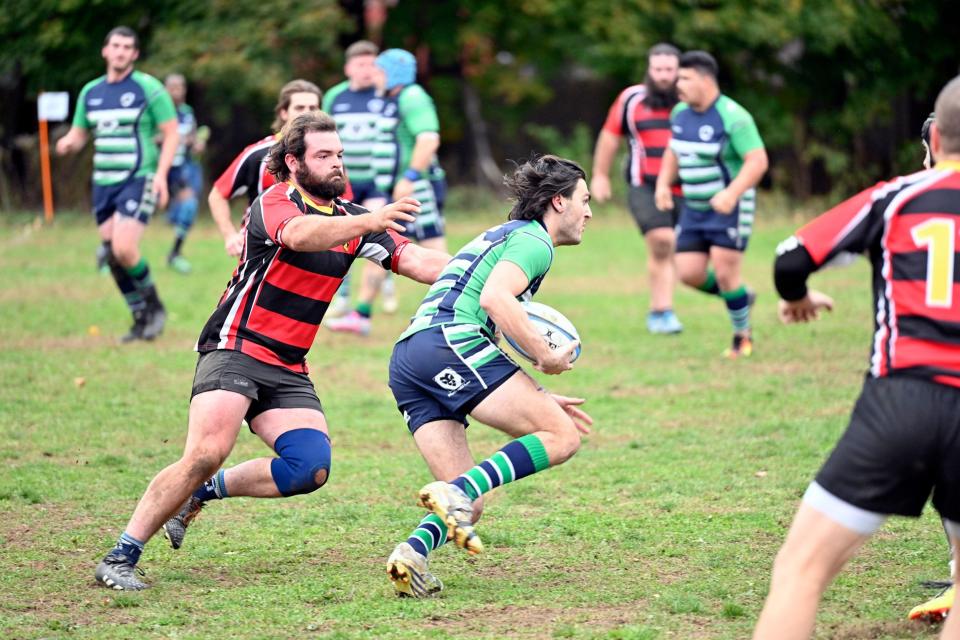 Fullback Nick DeVos on a counterattacking run during the first half of the home semi-final against Mad River-Stowe Rugby.