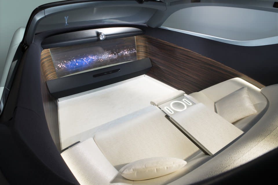 <h3>Because the car envisions a completely autonomous future, the interior is composed entirely of a two-person, silk sofa, and a giant OLED TV.</h3>