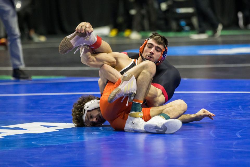 Mar 17, 2023; Tulsa, OK, USA;  Princeton wrestler Pat Glory, right, wrestles Nebraska wrestler Liam Cronin in a 125-pound weight class semifinal match during the NCAA Wrestling Championships at the BOK Center. Mandatory Credit: Brett Rojo-USA TODAY Sports