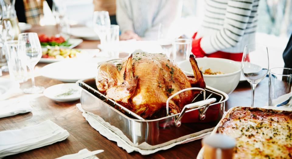 Even Christmas dinners should be socially distanced where possible - with the suggestion that one person does the plating up(Getty)