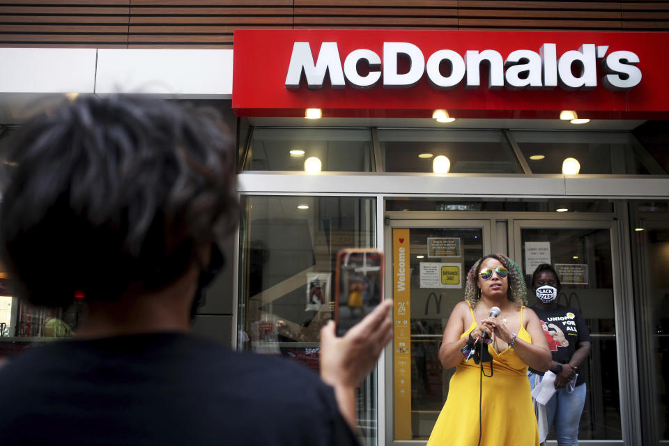 Amika Tendaji of Black Lives Matter Chicago speaks to people outside the McDonald's restaurant on 180 W. Adams St. in Chicago on Monday, July 20, 2020. The event is a part of a nationwide strike that organizers hoped would involve tens of thousands of people walking off the job. Dubbed the "Strike for Black Lives," the protest was arranged by labor unions and social and racial justice organizations, which planned a range of actions in more than two dozen U.S. cities. (AP Photo/Joshua Housing)