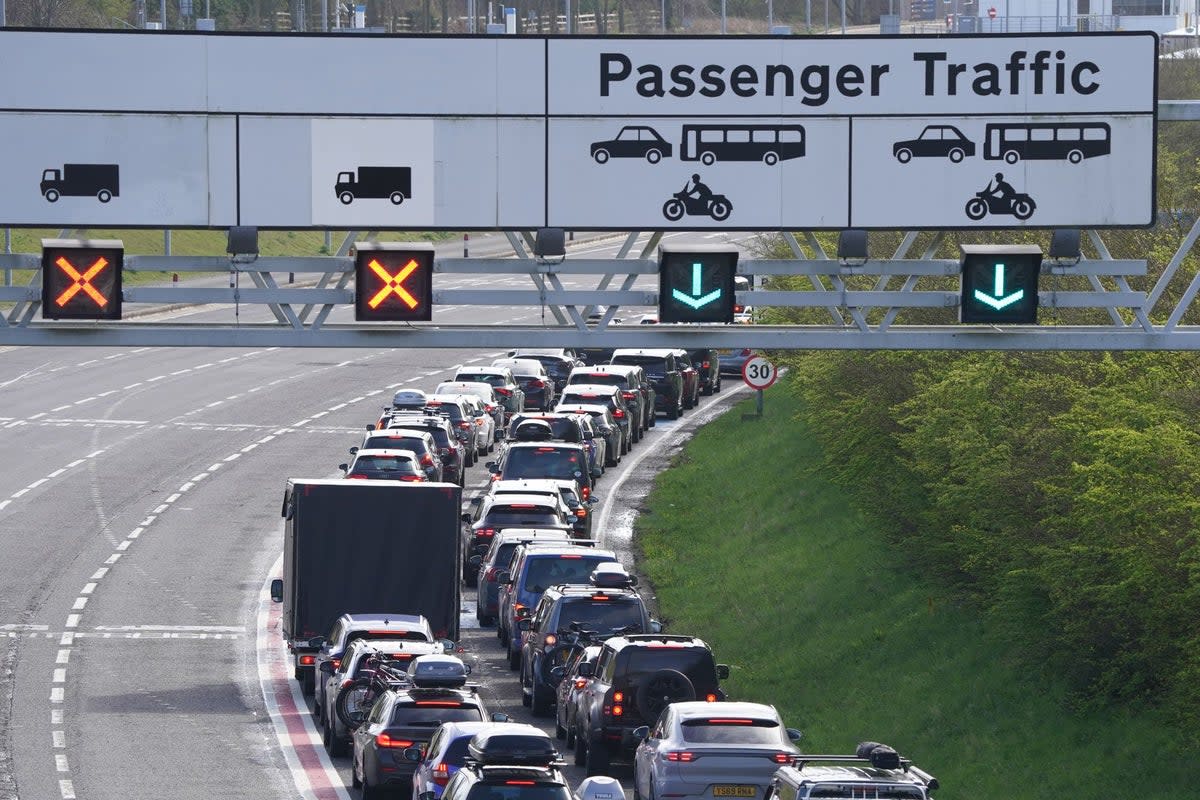 Passengers queue to enter the Eurotunnel site in Folkestone in Kent  (Gareth Fuller/PA Wire)