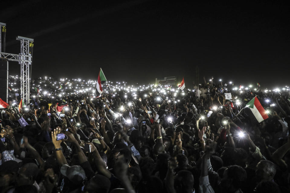 Sudanese protesters use their smartphones' lights during a protest outside the army headquarters in the capital Khartoum on Sunday, April 21, 2019. The organizers of Sudan's protests said Sunday they have suspended talks with the ruling military council because it has failed to meet their demands for an immediate transfer to a civilian government following the overthrow of President Omar al-Bashir. (AP Photo)