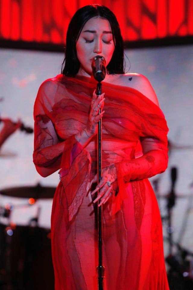 Noah Cyrus Porn - Noah Cyrus Commands Attention in Risky Red Sheer Dress & Hidden Heels For  'Jimmy Kimmel Live' Performance