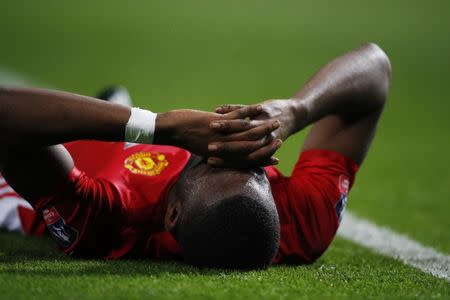 Britain Football Soccer - Manchester United v Wigan Athletic - FA Cup Fourth Round - Old Trafford - 29/1/17 Manchester United's Timothy Fosu-Mensah lies injured Action Images via Reuters / Jason Cairnduff Livepic EDITORIAL USE ONLY. No use with unauthorized audio, video, data, fixture lists, club/league logos or "live" services. Online in-match use limited to 45 images, no video emulation. No use in betting, games or single club/league/player publications. Please contact your account representative for further details.