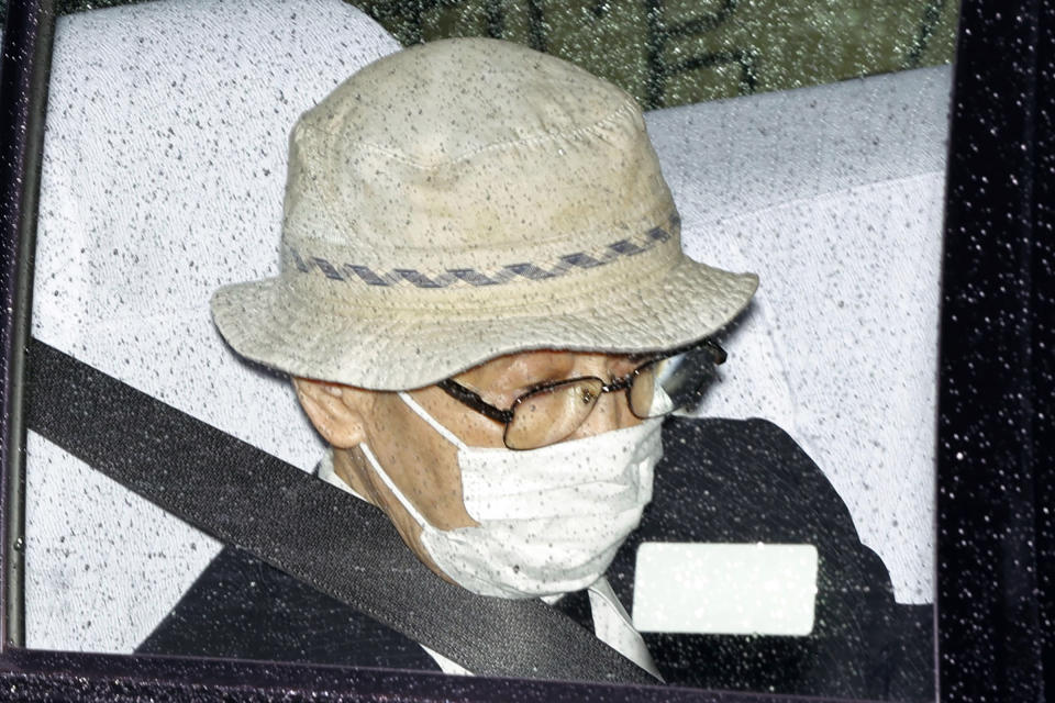 Kozo Iizuka is driven to Tokyo District Court to hear the court's ruling on his car accident in Tokyo Thursday, Sept. 2, 2021. The court on Thursday sentenced the 90-year-old former top bureaucrat to five years in prison in a 2019 fatal car accident on a busy Tokyo street, killing a 3-year-old girl and her mother in a high-profile case in a fast-aging country where elderly driving has become a major safety concern. (Kyodo News via AP)