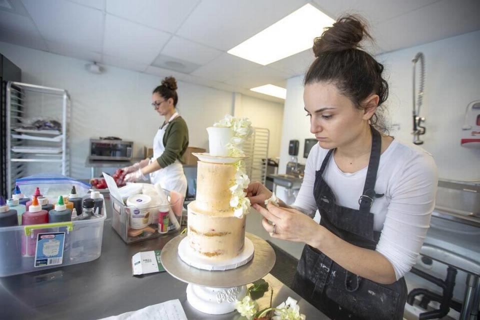 Sisters Elena Gavin, left, and Concetta Gulluni, right, are co-owners of Layered Cake Artistry in downtown Kennewick. The bakery hosts a Valentine’s pop-up market every year.