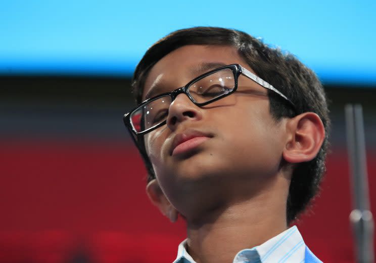 Rohan Rajeev reacts after misspelling a word during the finals of the 90th Scripps National Spelling Bee