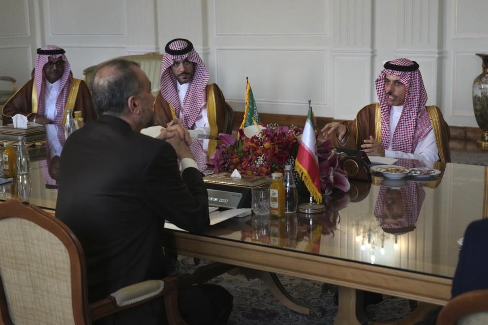 Saudi Arabia's Foreign Minister Prince Faisal bin Farhan, right, speaks in a meeting with his Iranian counterpart Hossein Amirabdollahian, left with back to camera, in Tehran, Iran, Saturday, June 17, 2023. Saudi Arabia’s top diplomat has arrived in the Iranian capital,Tehran, the latest step in the restoration of diplomatic ties between the two Mideast rivals, Iranian state media reported. (AP Photo/Vahid Salemi)