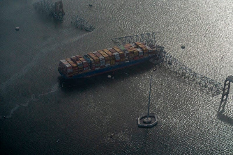 BALTIMORE, MD- March 26: The scene where Singapore-flagged container vessel Dali crashed into the Francis Scott Key Bridge in Baltimore, MD on March 26, 2024. - Photo: Carolyn Van Houten (Getty Images)