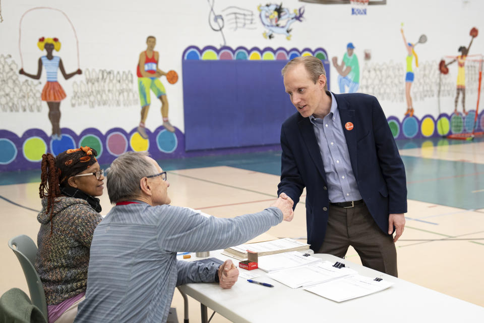 Minnesota Secretary of State Steve Simon visits election workers at Dayton's Bluff Recreation Center, a polling place in Ramsey County, as voters cast ballots for the 2024 Presidential Nominating Primary. Tuesday, March 5, 2024, St. Paul, Minn. (Glenn Stubbe/Star Tribune via AP)