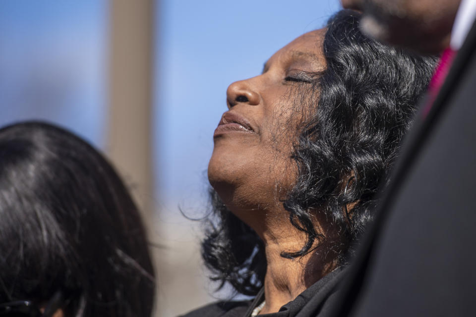 RowVaughn Wells, center, the mother of Tyre Nichols, stands during a press conference after an indictment hearing for five former Memphis police officers charged in the death of her son at the Shelby County Criminal Justice Center Friday, Feb. 17, 2023, in Memphis, Tenn. The former police officers, Tadarrius Bean, Demetrius Haley, Desmond Mills Jr., Emmitt Martin III and Justin Smith, pleaded not guilty to second-degree murder and other charges in the violent arrest and death of Nichols, (AP Photo/Brandon Dill)