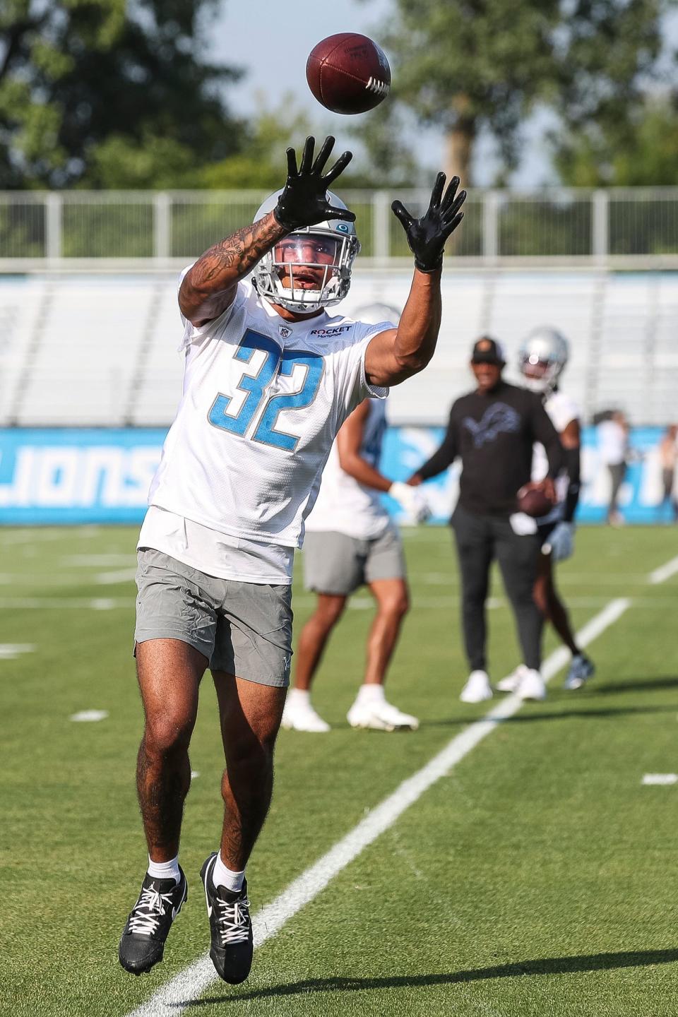 Detroit Lions safety Brian Branch makes a catch during training camp at the Detroit Lions Headquarters and Training Facility in Allen Park on Sunday, July 23, 2023.