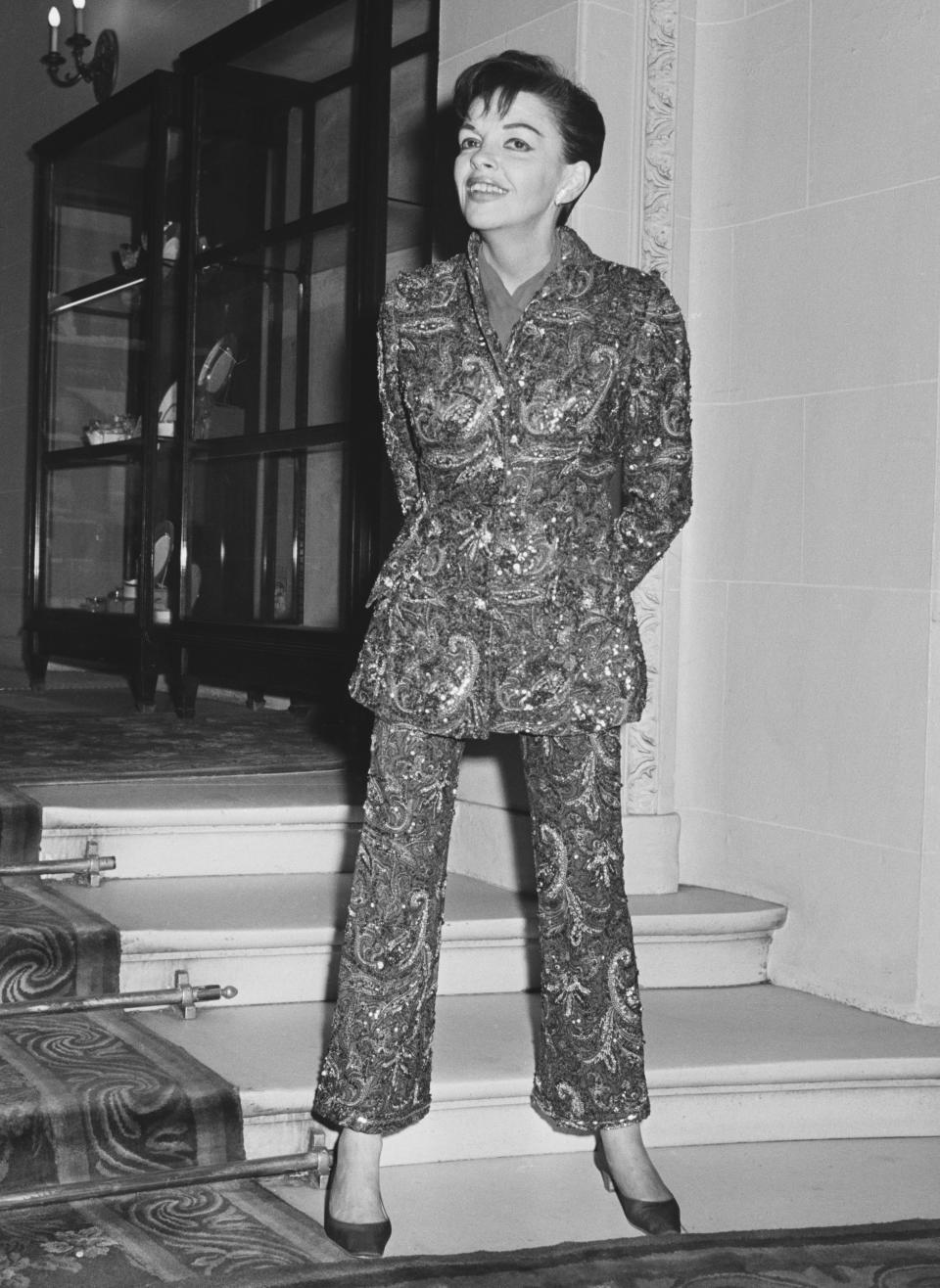 Garland wears a heavily embellished suit in this photo from 1968.&nbsp;