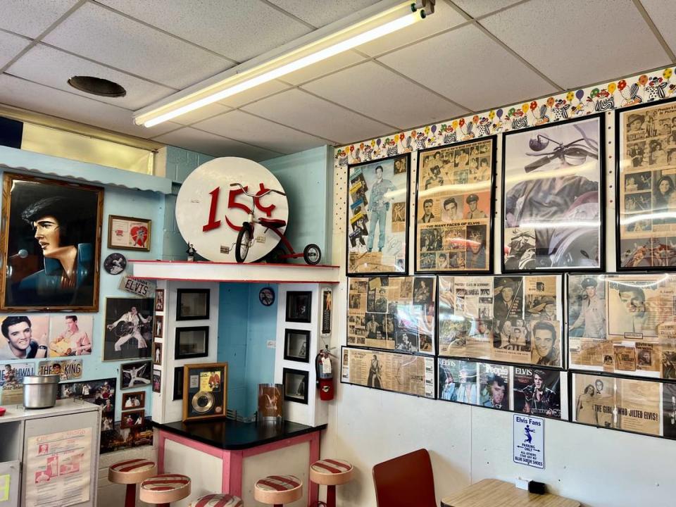 Elvis Presley posters and clippings retain a place of honor in Clown Burger, May 18, 2023.