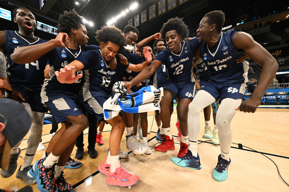 INDIANAPOLIS, IN - MARCH 19: St. Peter's Peacocks players celebrate after they defeated the Murray State Racers in the second round of the 2022 NCAA Men's Basketball Tournament held at Gainbridge Fieldhouse on March 19, 2022 in Indianapolis, Indiana. Murray State won 70-60. (Photo by Jamie Sabau/NCAA Photos via Getty Images)