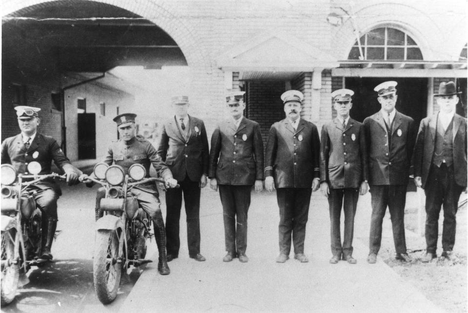 Police Chief Davis, fourth from right, featured in the first edition of the Sarasota Herald.