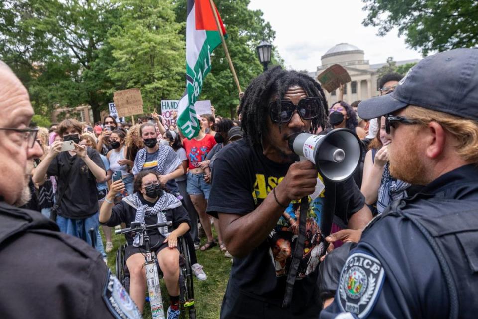 Pro-Palestinian demonstrators clash with police after replacing an American flag with a Palestinian flag Tuesday, April 30, 2024 at UNC-Chapel Hill. Police removed a “Gaza solidarity encampment” earlier Tuesday morning.