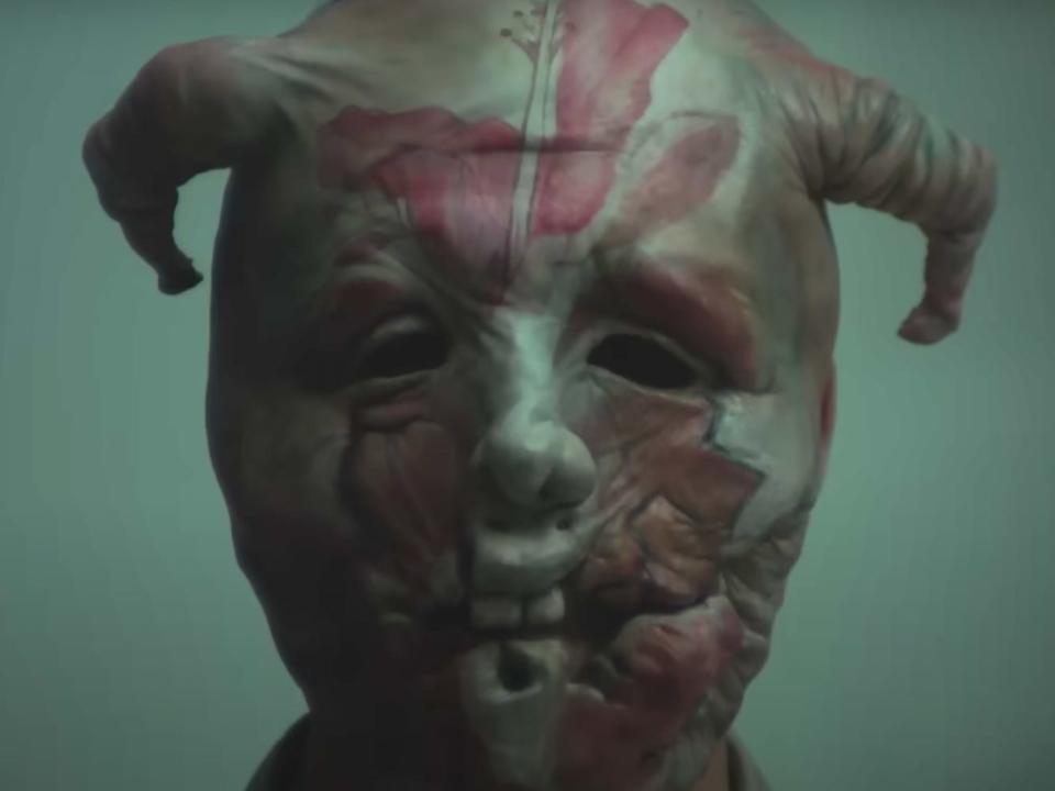 Alexander Skarsgard wearing a mask in "Infinity Pool."