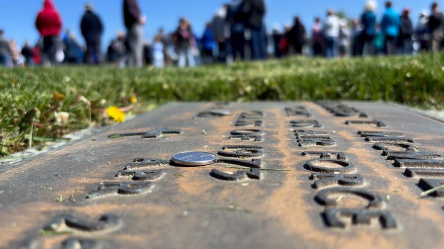 Several gravestones were topped with coins, a sign of respect for one's service.