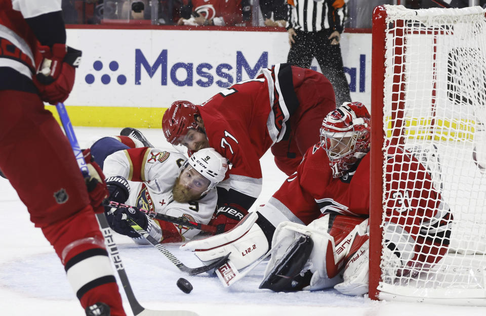 Florida Panthers' Sam Bennett (9) tries to shoot on Carolina Hurricanes goalie Frederik Andersen (31) during the second overtime in Game 1 of the NHL hockey Stanley Cup Eastern Conference finals, early Friday, May 19, 2023, in Raleigh, N.C. (AP Photo/Karl B DeBlaker)