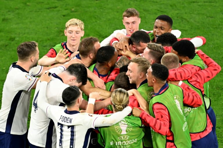 England players celebrate <a class="link " href="https://sports.yahoo.com/soccer/players/388827/" data-i13n="sec:content-canvas;subsec:anchor_text;elm:context_link" data-ylk="slk:Ollie Watkins;sec:content-canvas;subsec:anchor_text;elm:context_link;itc:0">Ollie Watkins</a>' winner against Netherlands in the Euro 2024 semi-finals (INA FASSBENDER)
