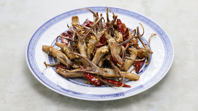 Fried duck tongues on plate