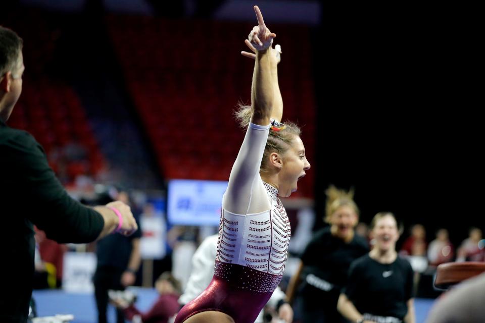 Oklahoma's Allie Stern celebrates after her vault during OU's women's gymnastic NCAA Regional final at Lloyd Noble Center in Norman, Okla., Saturday, April 2, 2022.