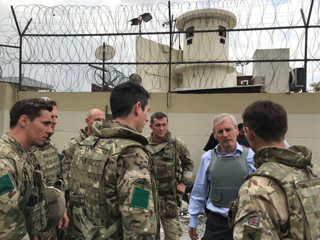 British ambassador to Afghanistan Sir Laurie Bristow, second right, with Government staff in Kabul (FCO/PA) (PA Media)