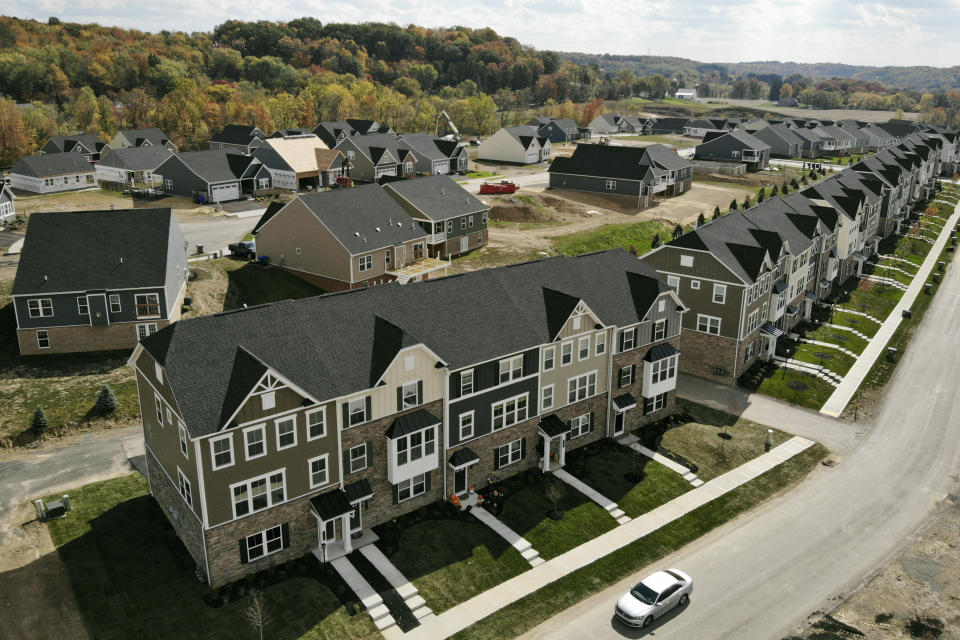 In this image taken with a drone, new townhouses are shown in Valencia, Pa., on Thursday, Oct. 15, 2020. Sales of new homes fell by 3.5% in September to a seasonally-adjusted annual rate of 959,000 million units. The Commerce Department said Monday, Oct. 26, 2020, that despite the modest decrease, sales of new homes are up 32.1% from a year earlier, as the housing market remains strong despite the pandemic. (AP Photo/Ted Shaffrey)