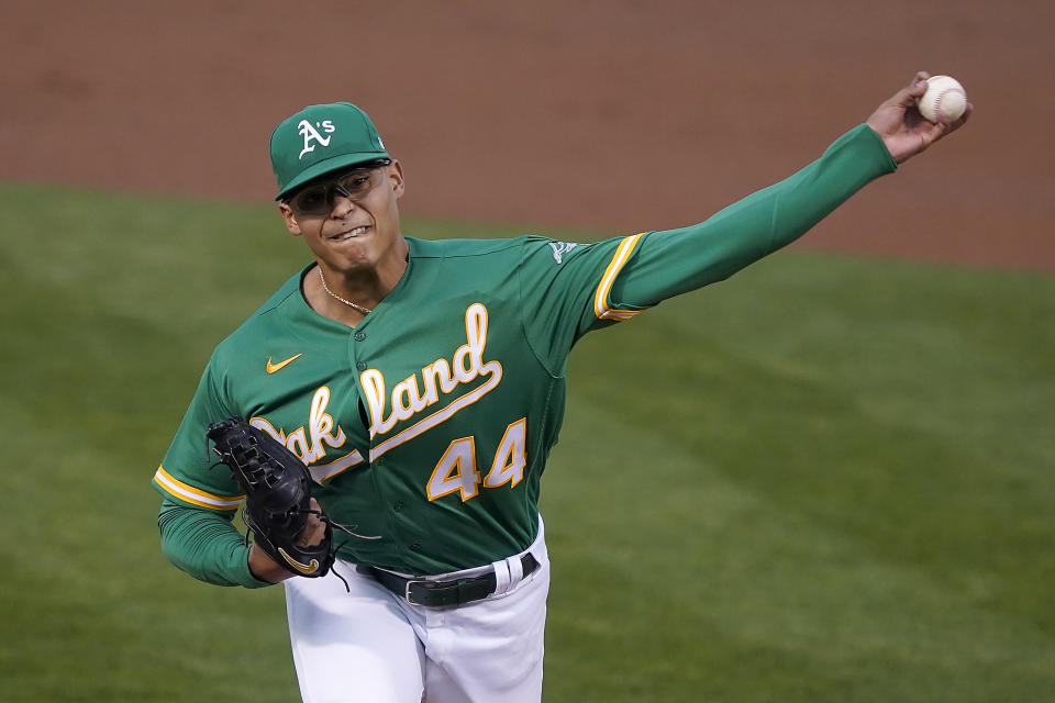 Oakland Athletics starting pitcher Jesus Luzardo throws against the San Diego Padres during the first inning of a baseball game in Oakland, Calif., Friday, Sept. 4, 2020. (AP Photo/Tony Avelar)