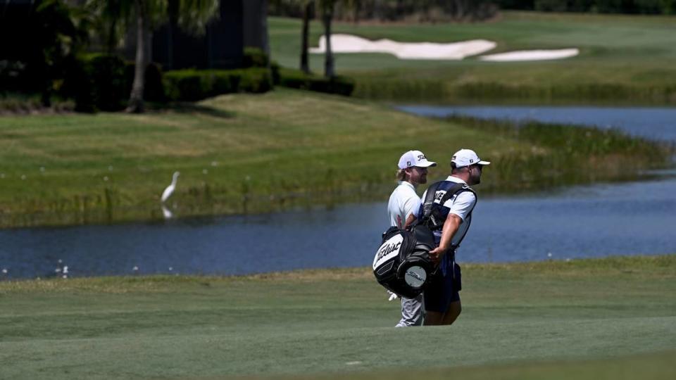 Danny Walker and his caddy walk the fairway of the 10th hole at the LECOM Suncoast Classic at Lakewood National Golf Club on April 18, 2024.