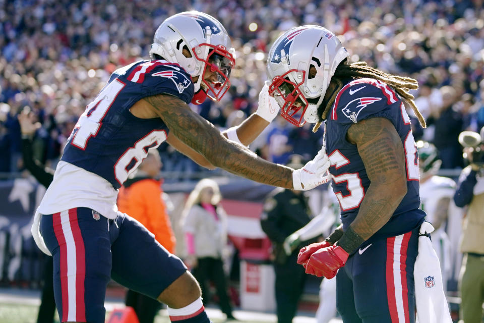 New England Patriots running back Brandon Bolden, right, is congratulated by Kendrick Bourne (84) after his touchdown during the first half of an NFL football game against the New York Jets, Sunday, Oct. 24, 2021, in Foxborough, Mass. (AP Photo/Steven Senne)