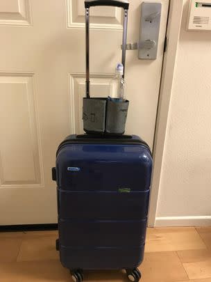 A luggage-mounted cup caddy