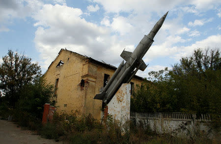 A monument depicting an anti-aircraft missile system Krug (Circle) stands outside a damaged, former military unit near the airport in Donetsk, Ukraine, September 13, 2017. REUTERS/Alexander Ermochenko