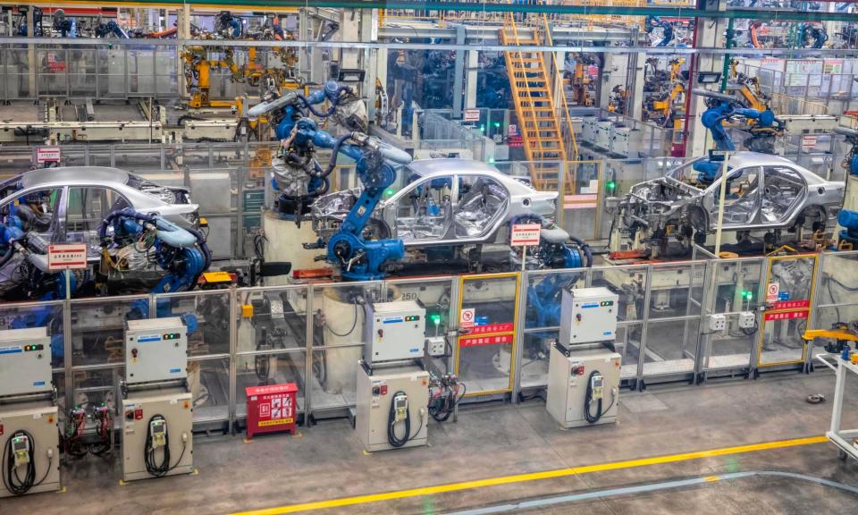 <span>Robots assemble cars in the BYD electric car factory in Xi'an.</span><span>Photograph: Alex Plavevski/EPA</span>