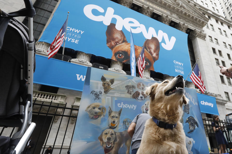 Local dog Frankie poses for photos outside the New York Stock Exchange, decorated for the Chewy IPO, Friday, June 14, 2019. Chewy, the online seller of pet food and squeaky toys, went public Friday and its shares soared 71%. (AP Photo/Richard Drew)