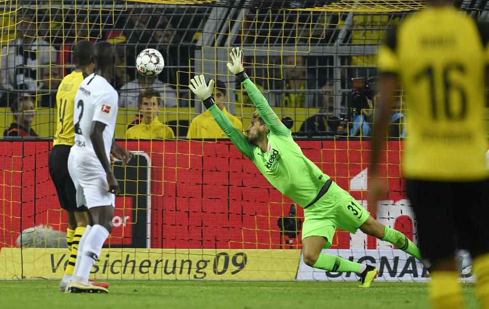 Frankfurt's keeper Kevin Trapp receives the third goal by Dortmund's Paco Alcacer during the German Bundesliga soccer match between Borussia Dortmund and Eintracht Frankfurt in Dortmund, Germany, Friday, Sept. 14, 2018. (AP Photo/Martin Meissner)