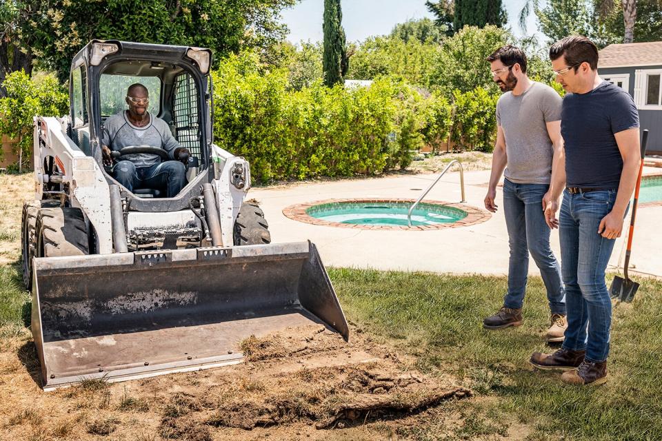 Terry Crews, along with Drew and Jonathan Scott, demo the outdoor living space for Terry's personal driver Frank, as seen on Celebrity IOU.