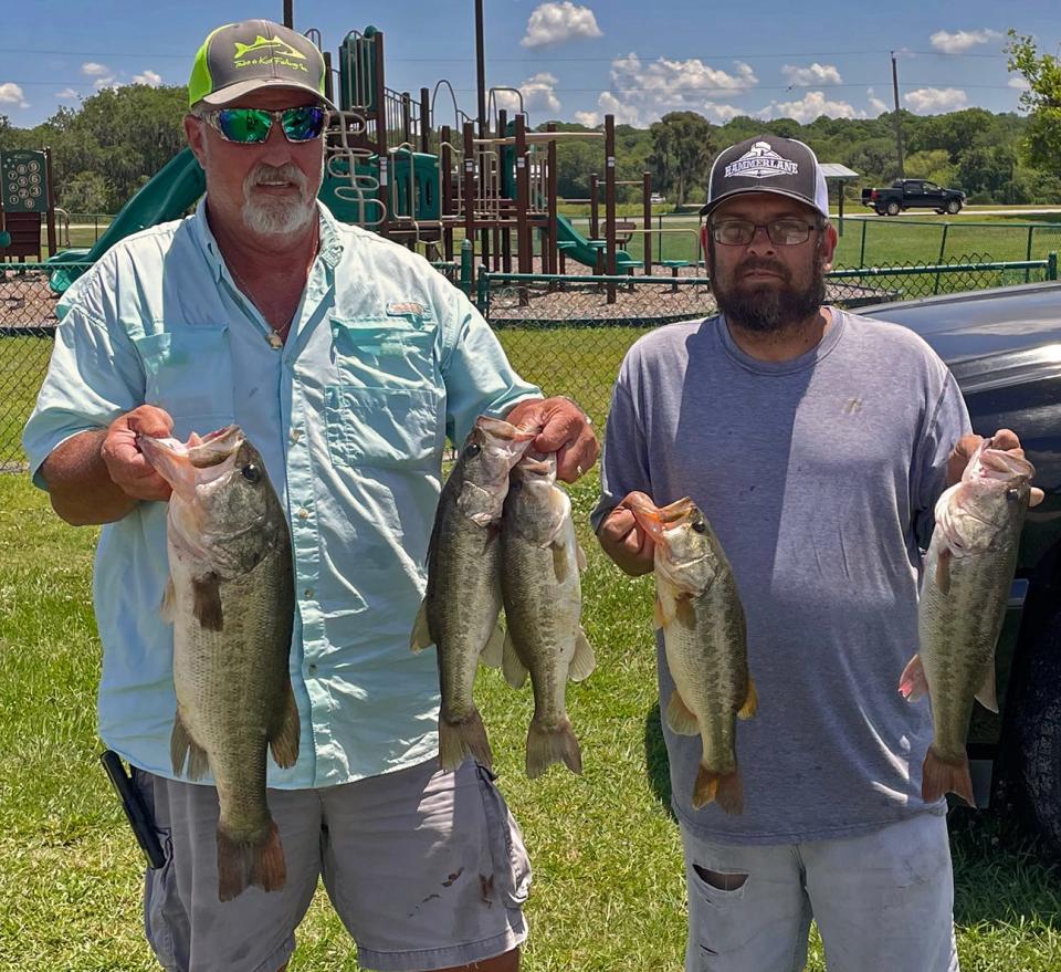 Anthony Coffman, left, and Scott Yutzy had 14.84 pounds and big bass with a 5.35 pounder to win the Polk County Bass Anglers Club tournament May 14 at Saddle Creek Park. 