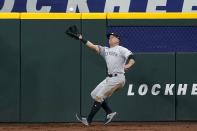 New York Yankees center fielder Brett Gardner reaches out to catch a fly ball by Texas Rangers' Nate Lowe in the first inning of a baseball game in Arlington, Texas, Tuesday, May 18, 2021. (AP Photo/Tony Gutierrez)