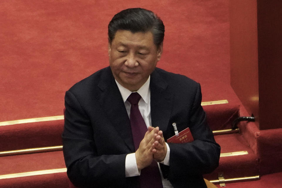 Chinese President Xi Jinping applauds during the closing session of the National People's Congress (NPC) at the Great Hall of the People in Beijing, Thursday, March 11, 2021. China's ceremonial legislature on Thursday endorsed the ruling Communist Party's latest move to tighten control over Hong Kong by reducing the role of its public in picking the territory's leaders. (AP Photo/Sam McNeil)