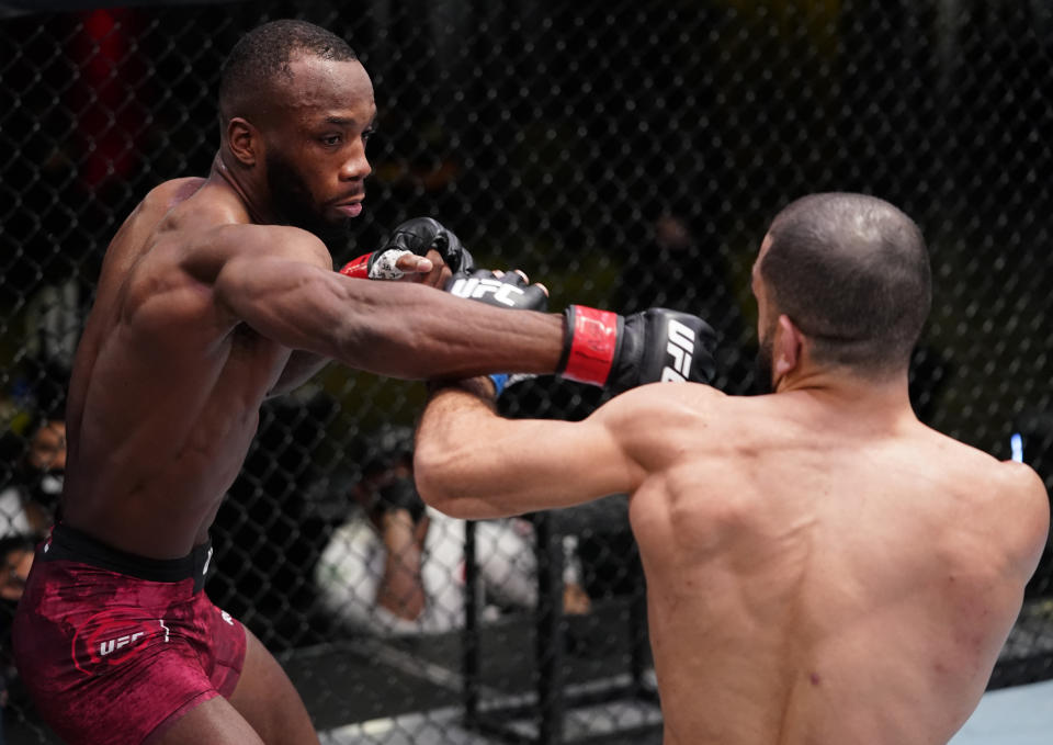 LAS VEGAS, NEVADA - MARCH 13: (L-R) Leon Edwards of Jamaica punches Bulal Muhammad in a welterweight fight during the UFC Fight Night event at UFC APEX on March 13, 2021 in Las Vegas, Nevada. (Photo by Jeff Bottari/Zuffa LLC via Getty Images)