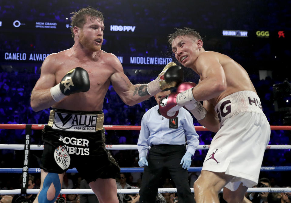 Canelo Alvarez lands a punch against Gennady Golovkin in the 12th round during a middleweight title boxing match, Saturday, Sept. 15, 2018, in Las Vegas. Alvarez won by majority decision. (AP Photo/Isaac Brekken)