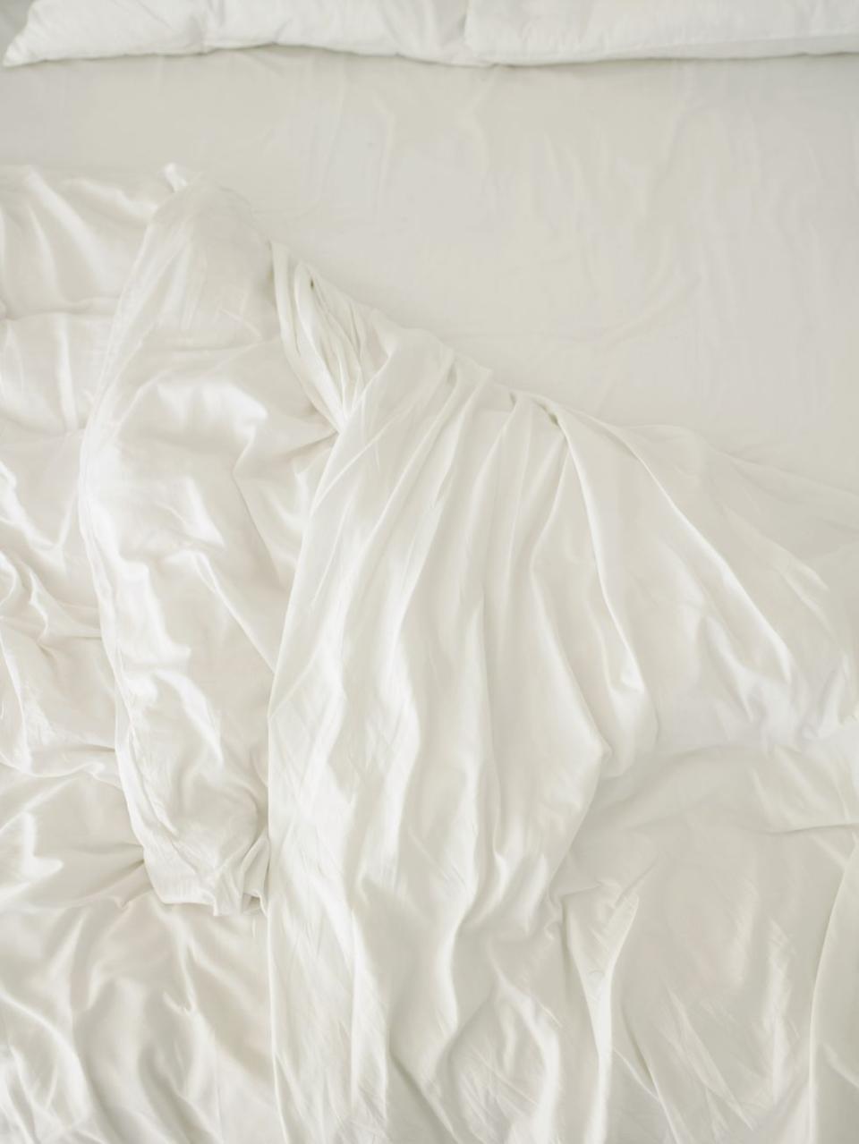 a white sheet on a bed