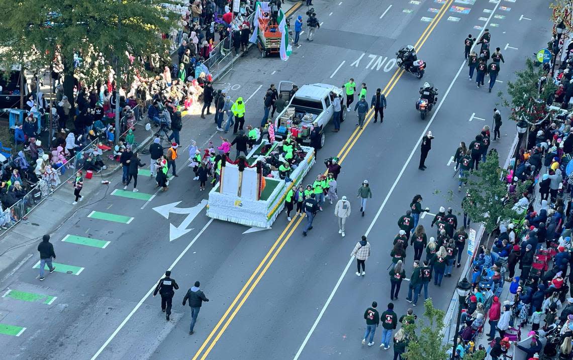Children are taken off a float after the truck pulling it went out of control fatally striking an 11-year-old girl at the Raleigh Christmas Parade Saturday, Nov. 19, 2022.