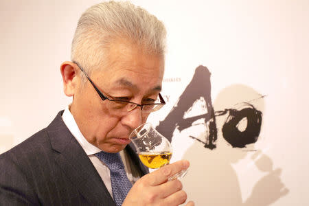 Suntory's chief blender Shinji Fukuyo smells Ao, Suntory's high-end world whisky, during its promotional event in Tokyo, Japan April 4, 2019. Picture taken on April 4, 2019. REUTERS/Ritsuko Ando