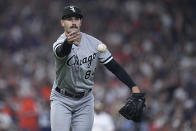 Chicago White Sox starting pitcher Dylan Cease tosses the ball to first baseman Andrew Vaughn for the out on Houston Astros' Jose Abreu during the fourth inning of a baseball game Thursday, March 30, 2023, in Houston. (AP Photo/Kevin M. Cox)