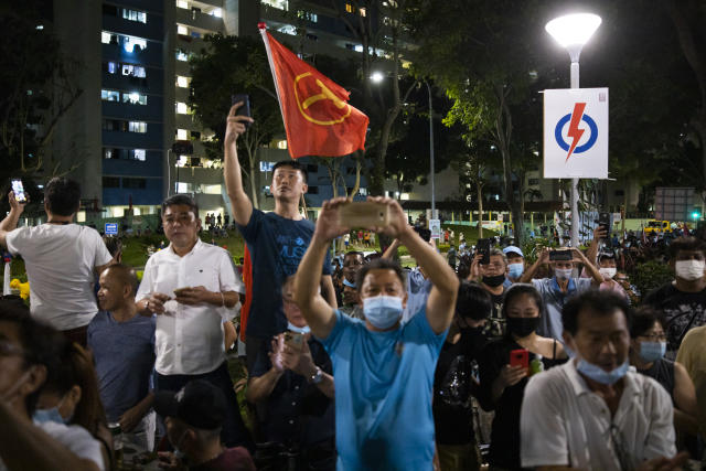 Supporters of the Workers' Party cheering at Hougang Avenue 5 in the early hours of 11 July, 2020, hours after the GE2020 polls have ended.  (PHOTO: Don Wong for Yahoo News Singapore)